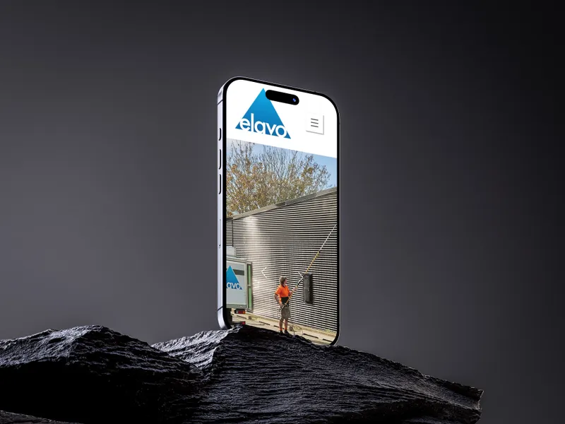 The Elavo website on a phone on a slate rock