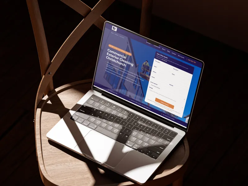 The Mobi-Vac website on a laptop on a wooden chair