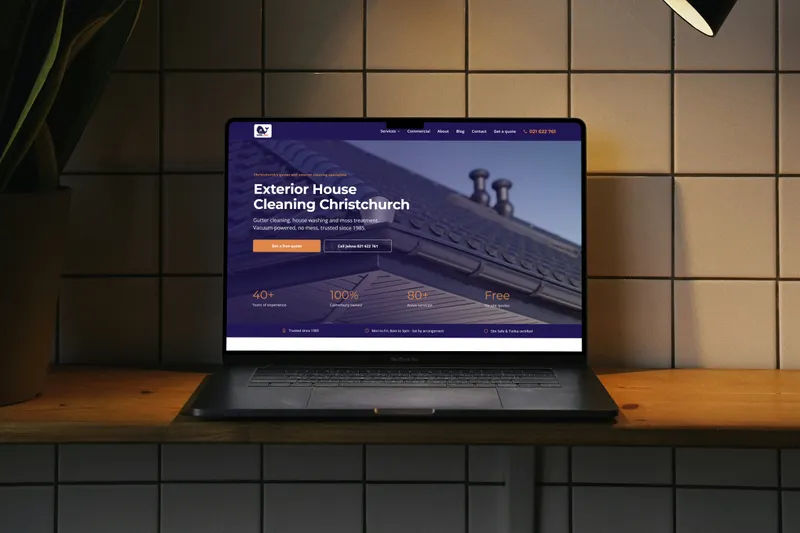 The Mobi-Vac website on a laptop against a dark tiled wall